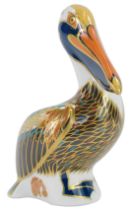 A Royal Crown Derby porcelain Brown Pelican paperweight, gold stopper and red printed marks, 13cm hi