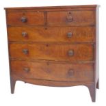 A Victorian mahogany and flame mahogany bow front chest, of two short and three long drawers, on tap