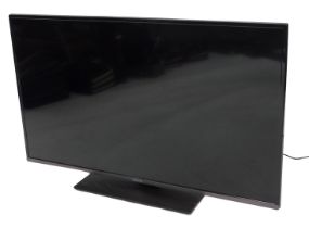 A Panasonic 43" television, TX-43HX580B, with lead and remote.