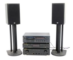 A stereo system, comprising Yamaha stereo cassette deck KX-393, a Marantz CD player CD5000 and integ