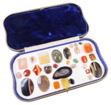 A cased set of semi precious stones, to include agate, tiger's eye, and others, each fixed and set i