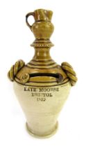 A 19thC stoneware money box, for Kate Moorse Bristol 1879, of twin rope handled cylindrical tapering