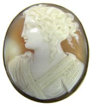 An early 20thC shell cameo brooch, the oval brooch depicting figure in flowing robes with curls, in