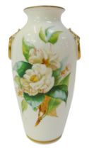 A Victorian porcelain two handled vase, of cylindrical tapering form, decorated with flowers to the