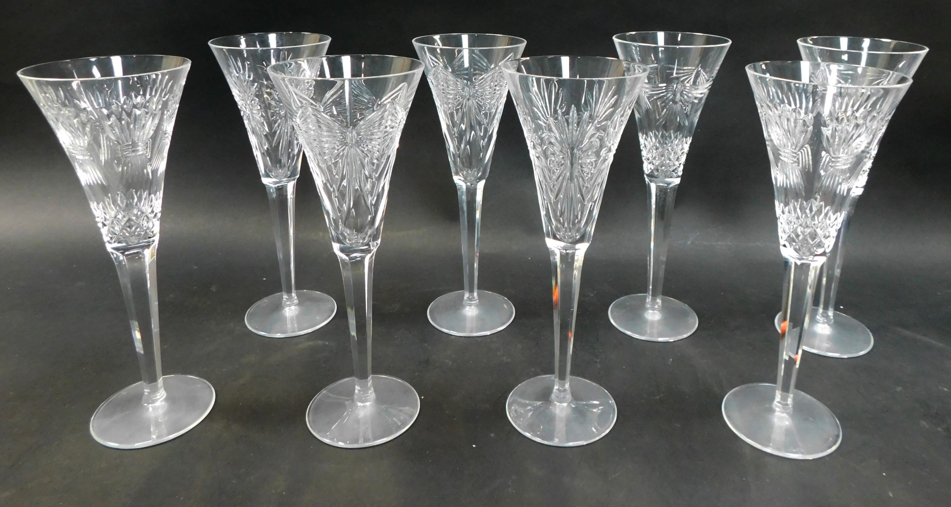 A set of eight Waterford Crystal Millennium Collection Champagne flutes, stamped, comprising two for