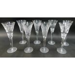 A set of eight Waterford Crystal Millennium Collection Champagne flutes, stamped, comprising two for