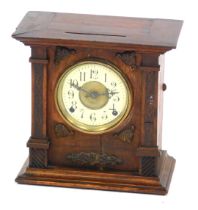 A late 19thC Continental oak cased mantel clock, circular brass dial with enamel chapter ring bearin