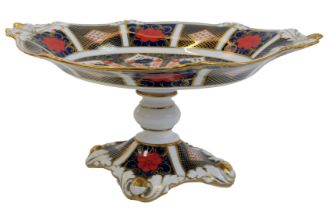 A Royal Crown Derby Old Imari porcelain comport, pattern 1128, with acorn embellishment, red