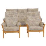 An Ercol Saville light elm framed three piece suite, comprising three seater sofa and two armchairs,