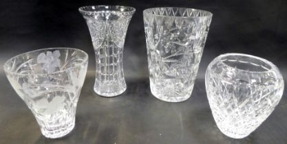 A group of cut glass vases, to include an example of cylindrical tapering form, 30cm high, trumpet f