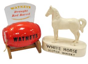 Breweriana. A White Horse Scotch Whisky advertising figure, 23cm high, and a Whatney's Draft Red Bar