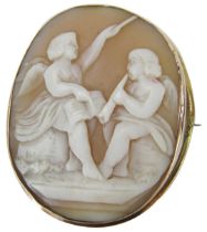 A 19thC shell cameo brooch, the oval cameo set with two female figures with wings, conducting and pl