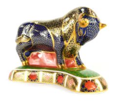 A Royal Crown Derby porcelain paperweight, modelled as a bull, gold stopper and red printed marks, 1