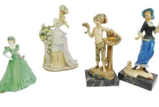 A Juliana Collection resin figure, modelled as a lady beside a plinth, with flowering shrubbery, on