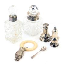 Two cut glass scent bottles and stoppers, with silver collars, 12cm and 11cm high, a silver salt spo