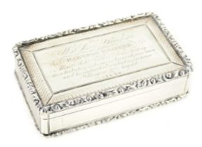 A William IV silver rectangular snuff box, with engine turned decoration, within a gadrooned border,