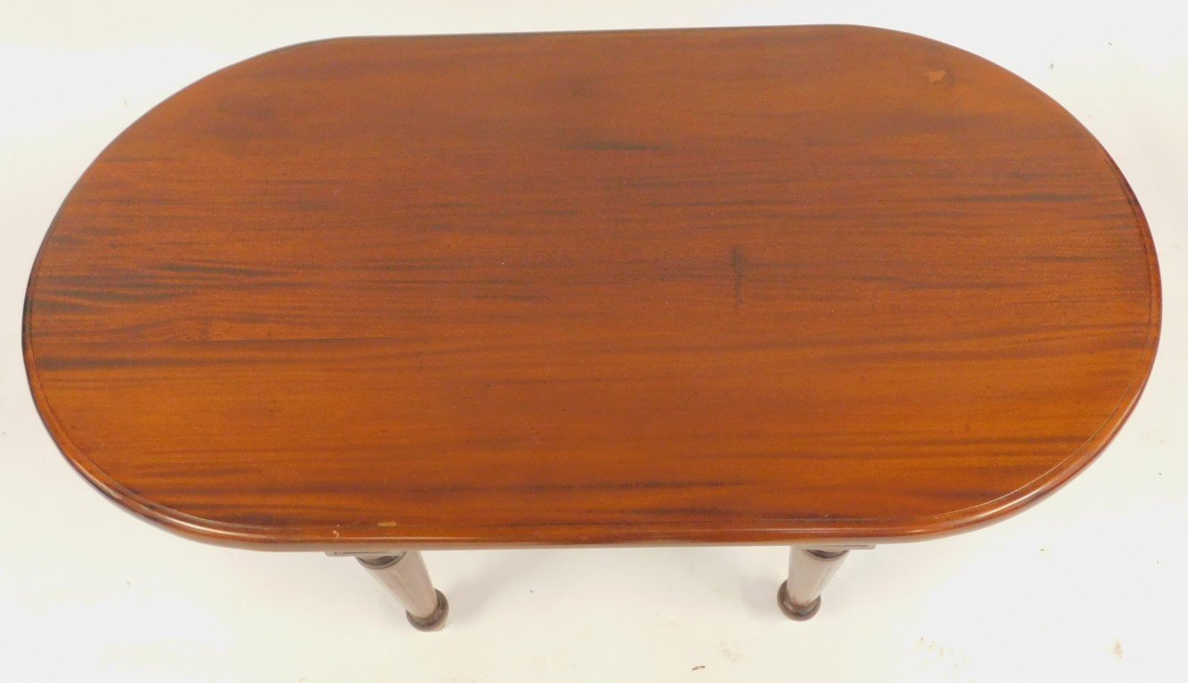 A 20thC mahogany coffee table, the oval top above a flower head and repeat twist pattern edge, on cy - Image 2 of 3
