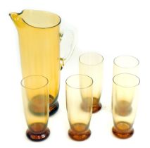A 20thC amber tinted glass lemonade set, comprising jug, 30cm high, and five glasses.