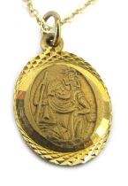 A 9ct gold St Christopher pendant on fine link chain, the pendant 1cm high, the chain 44cm long, 2.2