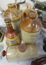 Stoneware, including two spirit flagons, whisky decanter, foot warmer, small bottle and storage jar.