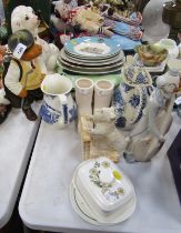 A Staffordshire style spaniel, commemorative plates, and a figure of a pig dressed in golfing attire