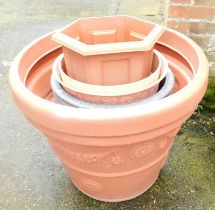 A quantity of plastic garden pots, one 75cm diameter.