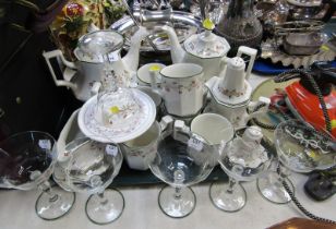 A pottery tea and coffee set, and six champagne glasses.