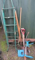 Various garden tools, to include logging saw, spades, grips, rakes, etc.