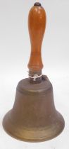 A brass hand bell, with turned beech wood handle, 27cm high.