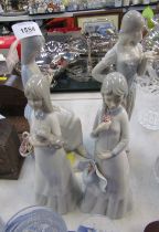 Four Valencia porcelain figures of ladies.