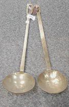 Two 19thC brass ladles.