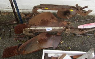 Two metal paddles for a plough.