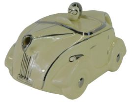 Motoring Interest. A James Sadler Art Deco race car teapot, cream, modelled as impressed marks to u