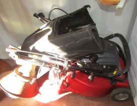 A Mountfield petrol lawn mower.