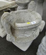 A pair of reconstituted stone garden urns, each with scroll handle, on a square foot, 53cm high, 36c