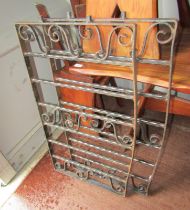 Two cast metal gates, each of scroll design, 53cm high, 92cm wide.