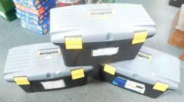 Three plastic tool chests and a small group of dictionaries.