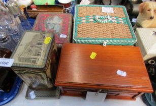 A mid century wicker sewing basket, 21cm wide, together with bygone tins for Thorntons, oak jeweller