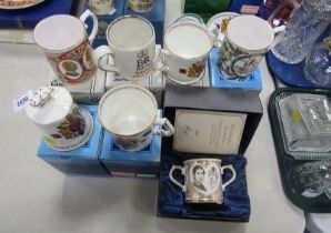 A group of commemorative mugs, to include Aynsley, a Royal Doulton loving to cup to commemorate the