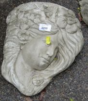 A reconstituted stone wall mask, of an Art Nouveau style female with flowing hair and flowers, 32cm