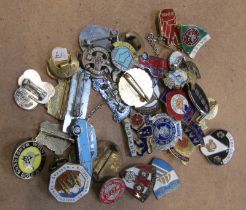 A collection of enamelled football badges and others, to include Manchester City, Derby County, West