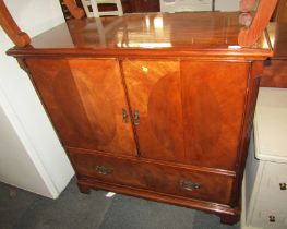 A 20thC mahogany television cabinet, the rectangular top with a moulded edge with cross banding, wit