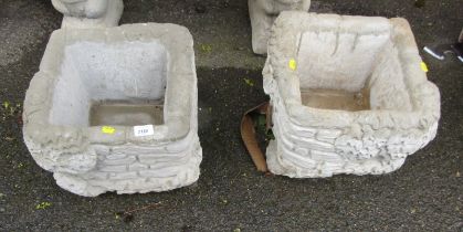 A pair of reconstituted stone garden planters, each square shaped with ivy leaf detail, 26cm high, 4