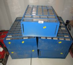 Five blue metal tool chests.