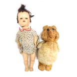 A Primo 1960s Teddy bear, 42cm high, and a Pedigree doll, in floral dress, 52cm high. (2)