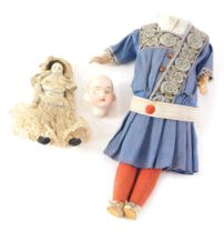 A 19thC bisque headed doll, with shut eyes and open mouth, on a composite body in original dress, ci