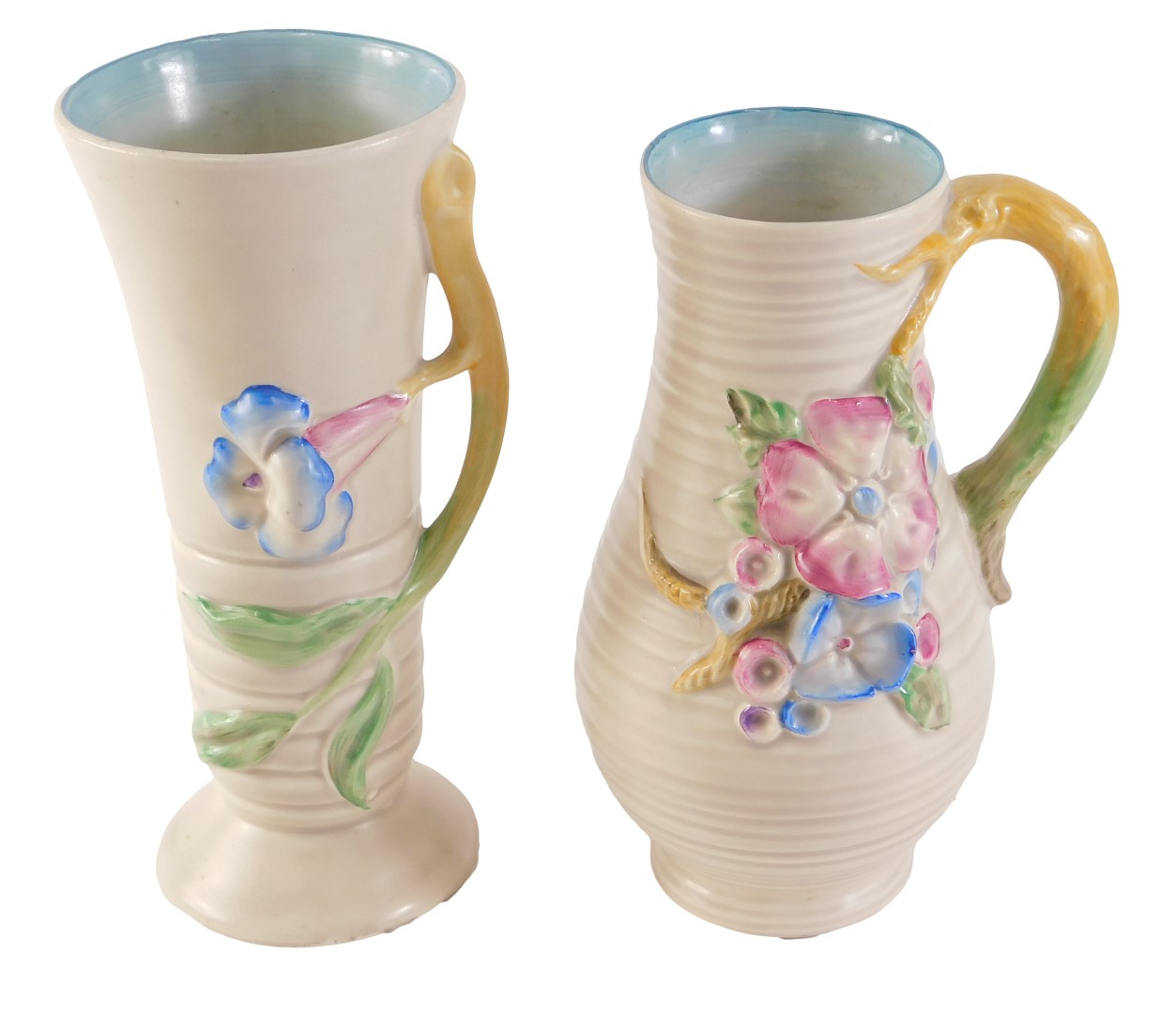 Two Clarice Cliff vases, each on a cream ground decorated with pink and blue flowers, 21cm and 20cm