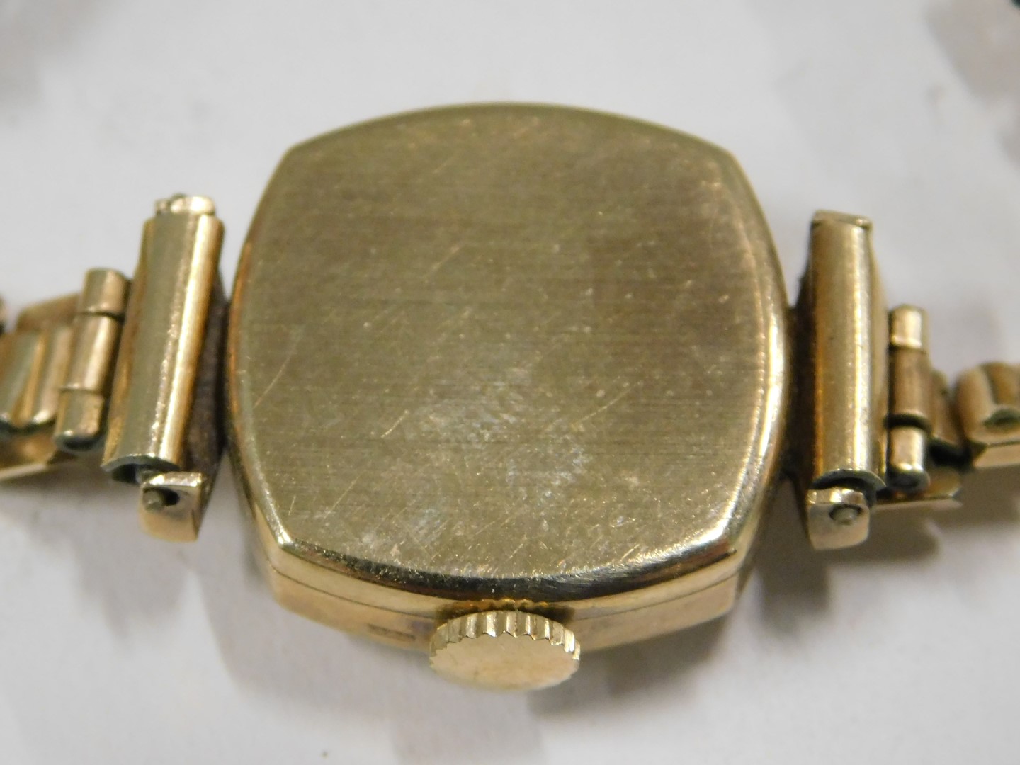 A PG lady's wristwatch, with a silvered numeric dial, in square case, 1.5cm diameter, yellow metal s - Image 3 of 4