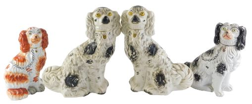 A collection of 19thC and later Staffordshire Spaniels, to include a larger black and white pair, 32