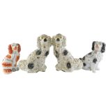 A collection of 19thC and later Staffordshire Spaniels, to include a larger black and white pair, 32